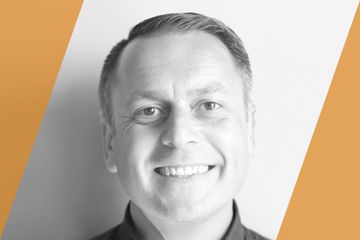 Black and white portrait of a person who is listed as an A List Travel Advisor 