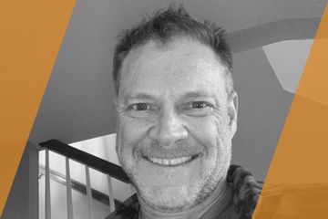 Black and white portrait of a person who is listed as an A List Travel Advisor 
