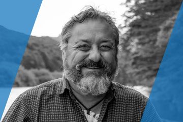 Black and white portrait of a person who is listed as an A List Travel Advisor 
