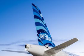 The tail of a JetBlue A220 Airplane