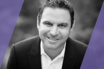 A black and white portrait/headshot of an A List Travel Advisor