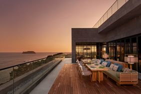 Flying Hog outdoor dining restaurant with ocean views at sunset