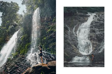 Women walk beside waterfalls in Malaysia