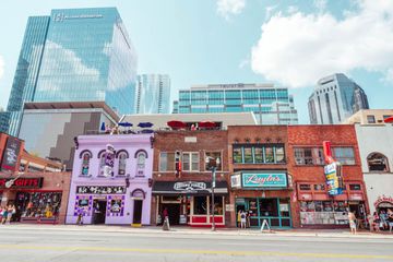 Original buildings on Broadway with skyscrapers behind them