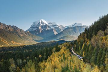A train goes around a mountain 