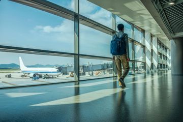 Rear View, Young Asian at the Airport in China