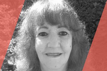 Black and white portrait of a person who is listed as an A List Travel Advisor 