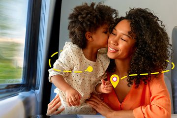 A mom and child on a Brightline train
