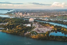 Sunset aerial view of Jean-Drapeau Island besides Montreal city