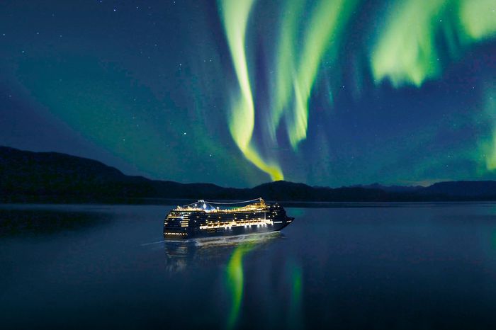 Cruise ship under Northern Lights in Alaska 