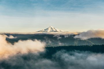 View of Mt Hood peaking over clouds