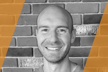 Black and white portrait of a person who is listed as an A List Travel Advisor 