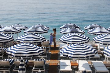 Blue and white beach umbrellas in Nice, France