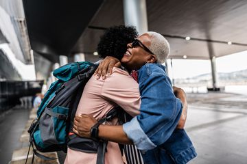Mature couple embracing at airport