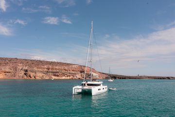 View of Paradero's catamaran boat on the water in Todos Santos