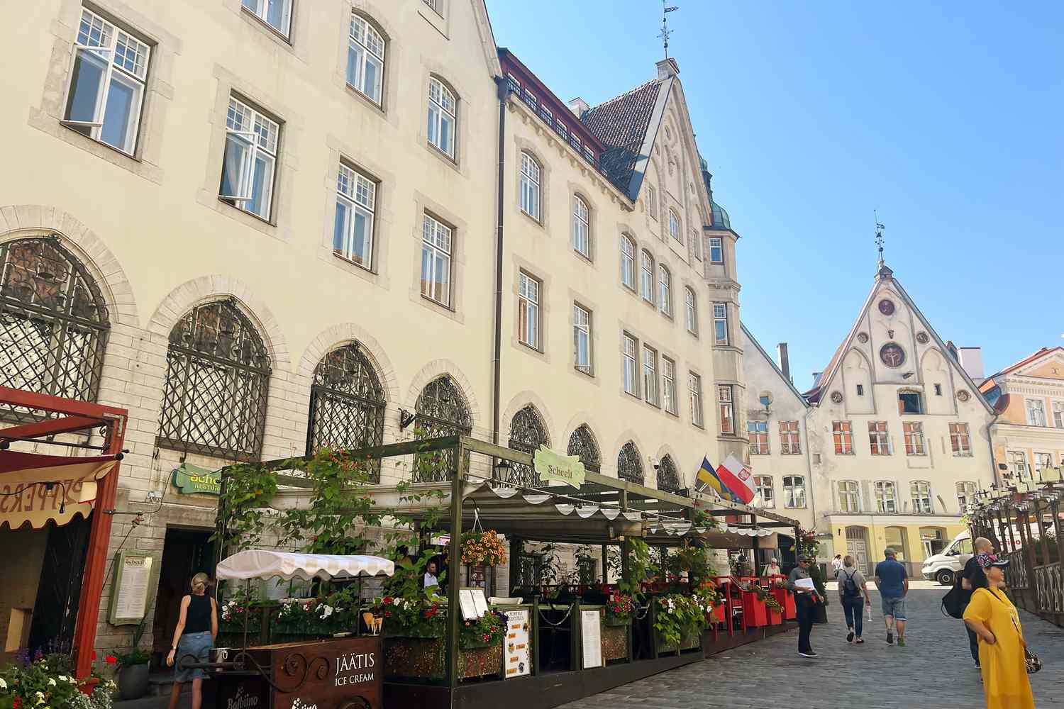 A plaza with cafes and market in Old Town