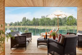 View of terrace off of primary bedroom at Lakes By Yoo cabin 