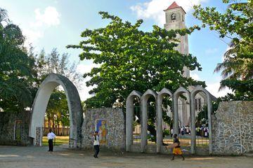 People walk in front of a church in Quelimane, Mozambique