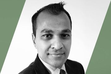 Black and white portrait of a person who is listed as an A List Travel Advisor 