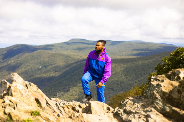 A man summiting a peak at Shenandoah National Park