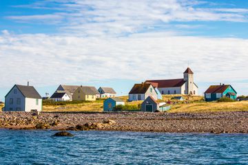 colorful salt box huts on the coast