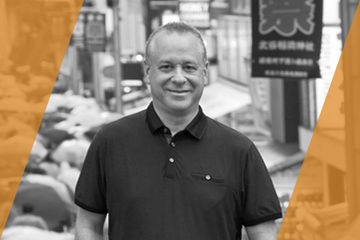 Black and white portrait of a person who is listed as an A List Travel Advisor 