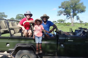 A group of people in safari vehicle