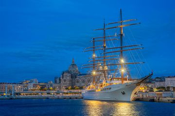 wide shot of ship docked at a port