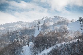 Ski lift on snowy mountain