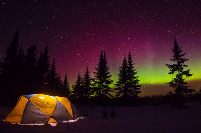 Tent camping under the northern lights
