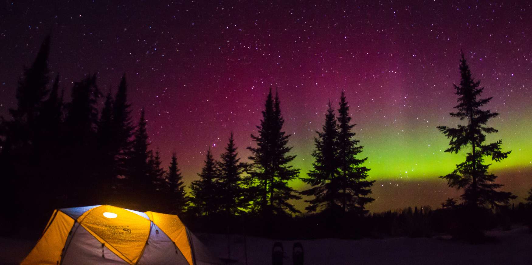 Tent camping under the northern lights
