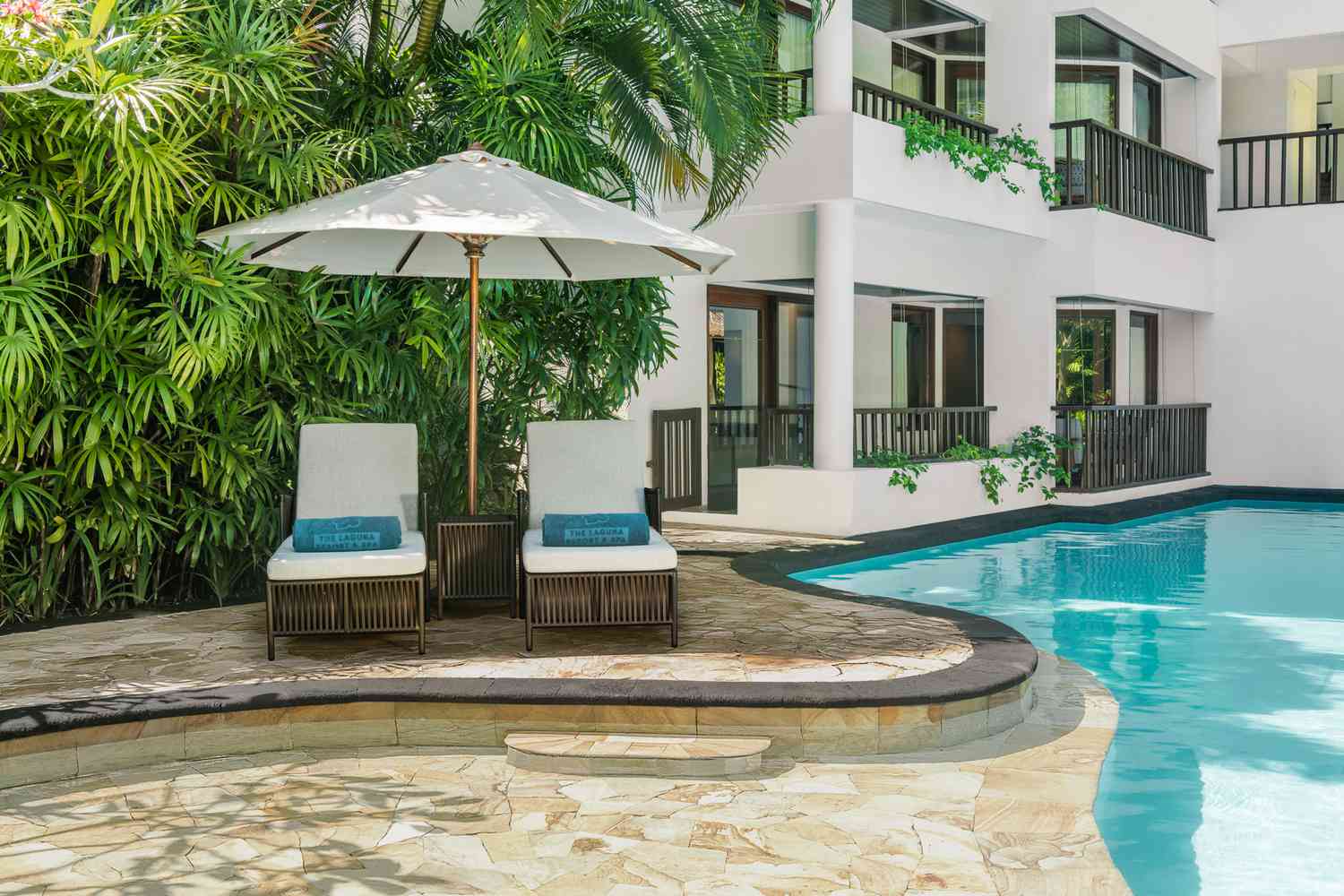 Pool deck and lounge chairs at the Laguna resort in Bali