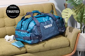 Thule Chasm Sport Duffel on a green sofa