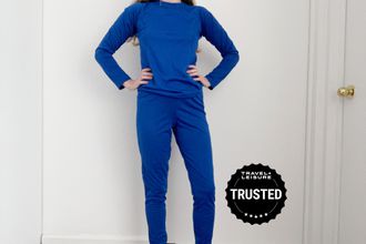 Person wearing Outdoor Research Women's Alpine Onset Merino 150 Crew top and pants
