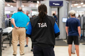 A Transportation Security Administration (TSA) officer at Hartsfield-Jackson Atlanta International Airport (ATL) in Atlanta, Georgia, US, on Monday, Oct. 2, 2023. The FAA's authority over federal aviation programs has been extended through Dec. 31 as part of the stopgap legislation to keep the government open that President Joe BidenÂ signed on Saturday, narrowly averting a lapse as long-term reauthorization remains tied up in disagreement over pilot training. 