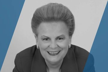 Black and white portrait of a person who is listed as an A List Travel Advisor 