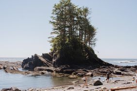 People walking along the coast of Vancouver Island