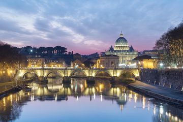 View to St Peter's Basilica and Vatican City at sunset