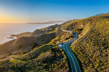 Aerial shot at the pacific at sunset Pacific coast road Highway 1 California. 