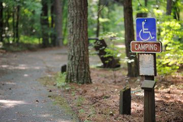 Camping site in campground with handicapped sign