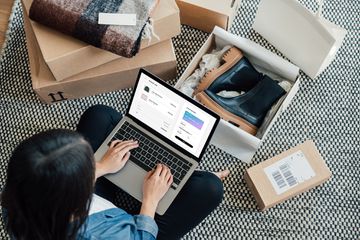A Woman Doing Online Shopping With Laptop