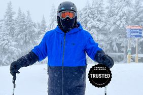 person wearing Ski Jacket with snow on trees