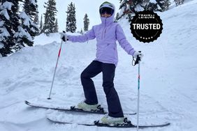 A woman skiing in one of our best ski jackets for women