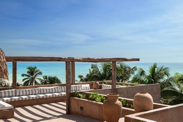 XELA Tulum rooftop lounge with ocean views