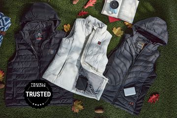 Best heated vests displayed on grass with leaves
