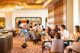 Characters interact with families during breakfast at Topolino’s Terrace