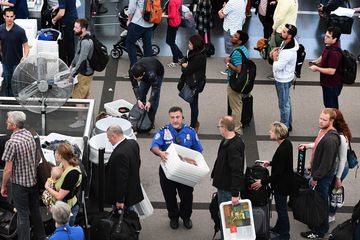 Travelers, at Denver International Airport
