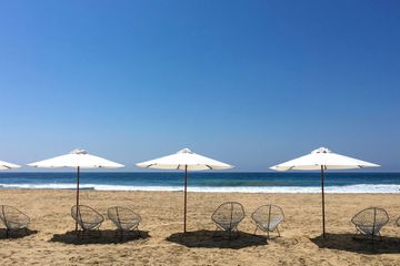 Beach with Row of Umbrellas with Pacific Ocean, Zipolite, Oaxaca State, Mexico